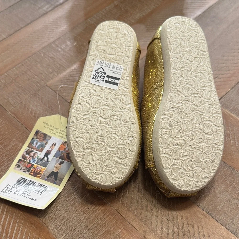TOMS Tiny Kids Shiny Gold Glitter Shoes - Picture 2 of 4